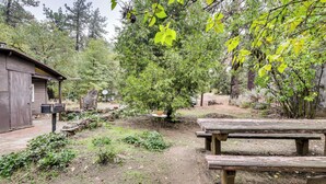 A rustic outdoor area with a wooden bench, a small table, and a shed. - Modern Backcountry Retreat! Bike & Hike Mt Laguna (Mount Laguna)