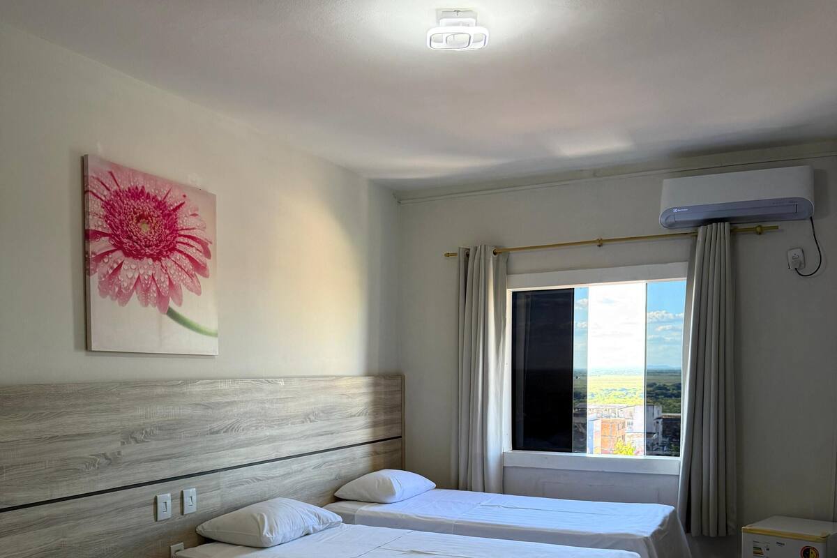 Standard Triple Room, City View | Laptop workspace, WiFi (free), bed sheets
