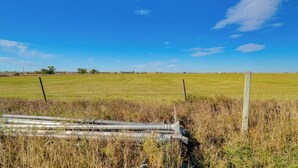 A rural landscape with a fence, a field, and a clear sky. - Pet-friendly Farmhouse Suite w/ Patio in Vaughn! (Vaughn)