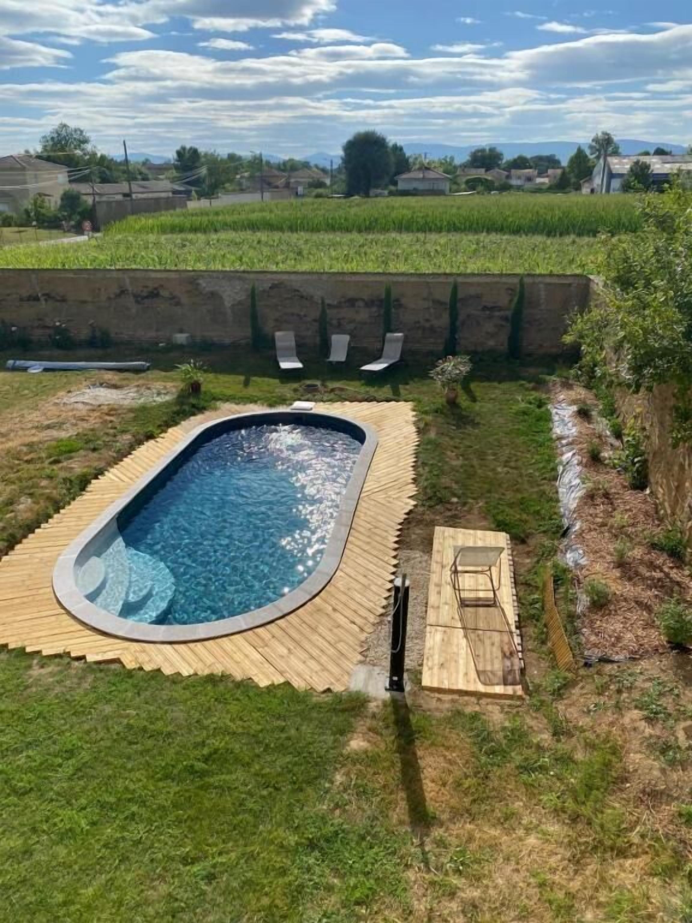 Seasonal outdoor pool, open 8:00 AM to 8:00 PM, pool umbrellas