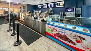 A food court with a counter for ordering and a display case for ice cream. - Lagoon Horizon 911-Gulf Views-Sleeps 7 (Panama City Beach)