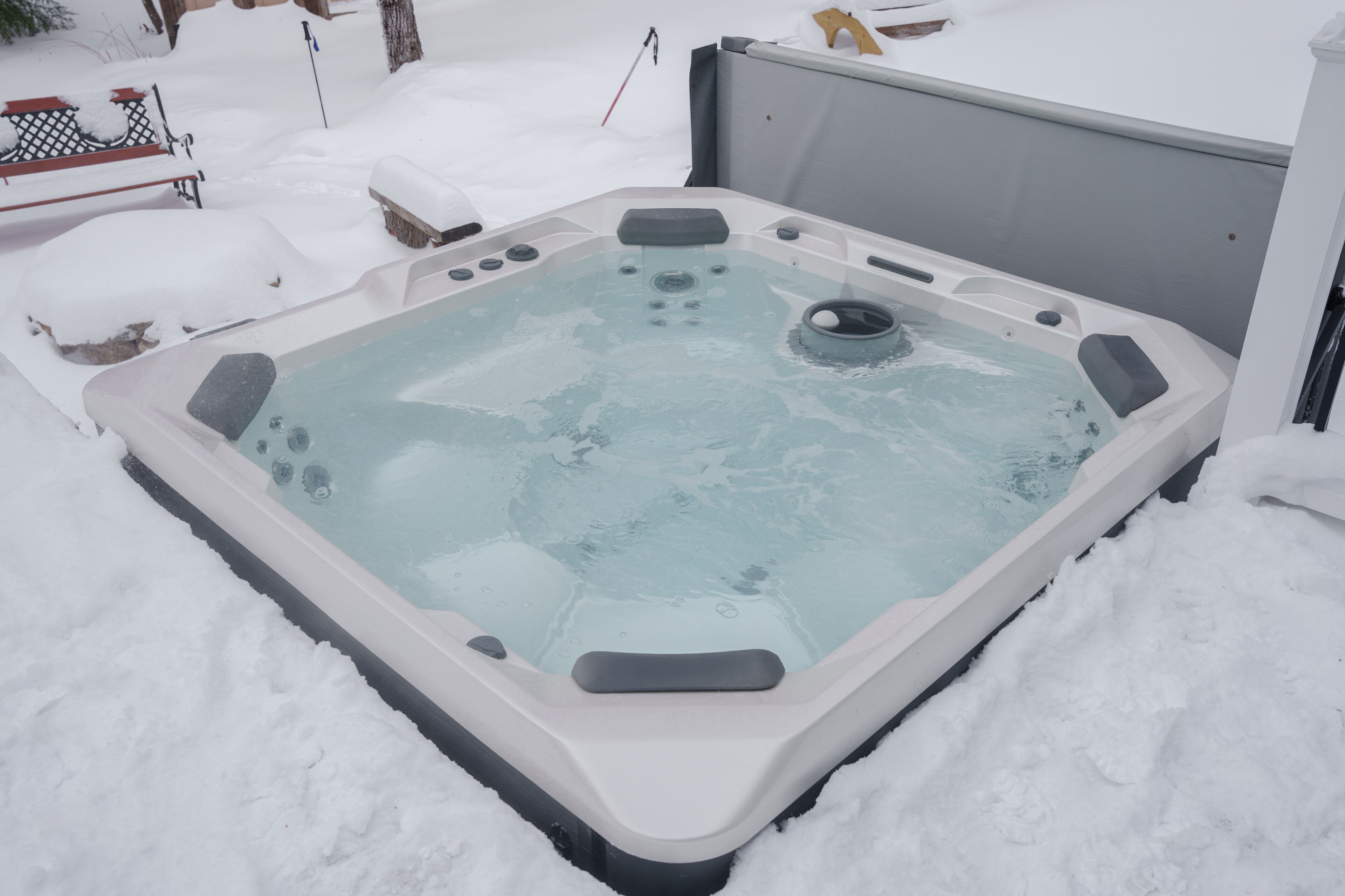 A hot tub in a snowy outdoor setting.