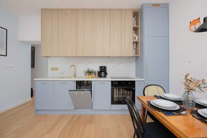 Fridge, microwave, oven, stovetop - Wandy 8 Warszawa | Family Apartment in Saska Kępa | Bright & Functional Interiors | Balcony (Warszawa)