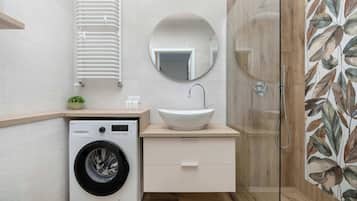 Shower, hair dryer, towels, shampoo