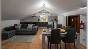 A modern apartment with a dining area, kitchen, and living room. - 2-bed apt with sea view |Ponta do Sol SeaView (Socorro)