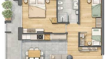 Un appartement comprenant deux chambres, une cuisine, un coin repas et un petit salon.