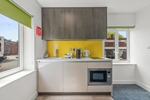 Fridge, microwave, stovetop, coffee/tea maker