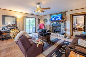 TV, fireplace, books - Mountain Escape w/ Game Room & Smoky Views! (Franklin)