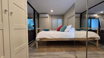 Apartment, Balcony, Pool View | In-room safe, blackout curtains, iron/ironing board, free WiFi