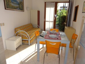 Apartment, 2 Bedrooms, Patio, Garden View | Living room - Apartment With Pool Access Near Beach (San Michele al Tagliamento)