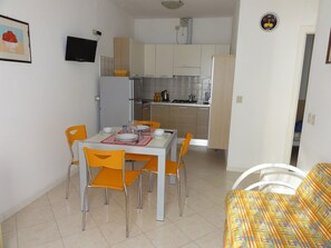 Apartment, 2 Bedrooms, Patio, Garden View | Dining room - Apartment With Pool Access Near Beach (San Michele al Tagliamento)