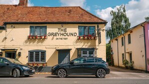 A building with a sign reading "The Greyhound On The Test". - The Greyhound on the Test (Stockbridge)