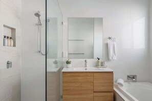 Shower, hair dryer, towels, shampoo