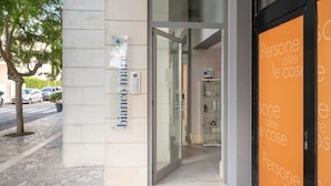 A building entrance with a sign reading 'bianco mare' and an adjacent glass door. - Apartment 'Biancomare Otranto - 5' with Sea View, Wi-Fi and Air Conditioning (otranto)