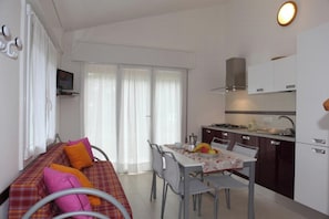 Villa, 2 Bedrooms, Patio, Garden View | Dining room - Comfy House in a Quiet Area Near the Beach (San Michele al Tagliamento)