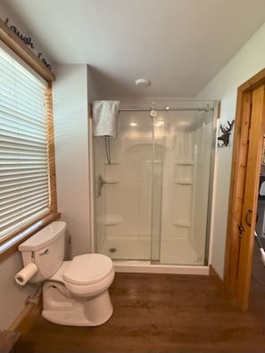 Shower, hair dryer, towels, toilet paper
