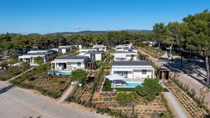 A modern resort with multiple villas, each featuring a pool and surrounded by landscaped gardens. - Amadria Park Sibenik Beach Villa for 7 persons (Sibenik)