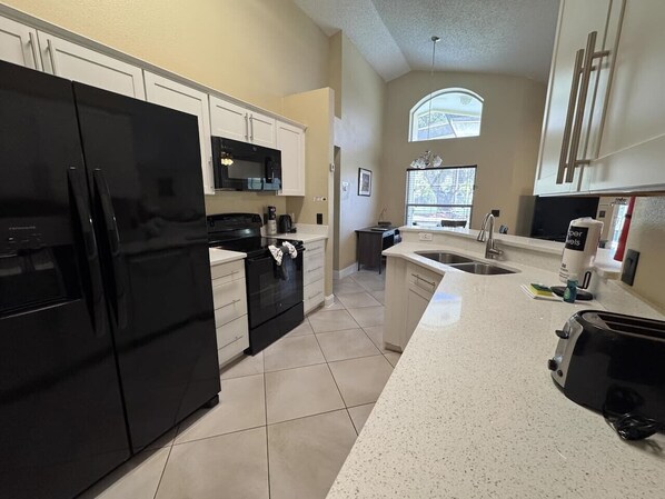 Coffee/tea maker, fridge, microwave, oven