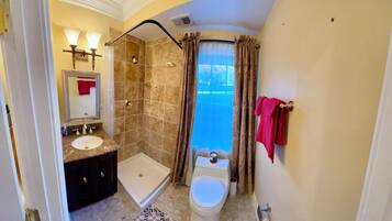 Shower, hair dryer, towels, soap