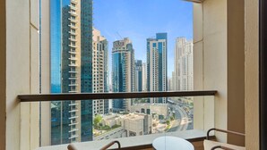 A balcony with a view of high-rise buildings and a busy road. - Cozy 3 Bedroom with walking access to JBR Beach (Jumeirah Beach Residence (JBR))