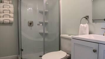 Shower, hair dryer, towels, soap