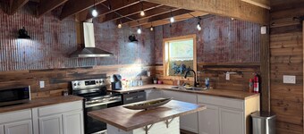 Charming and quiet  1-bedroom loft barndominium on 12 acres with RV hookups