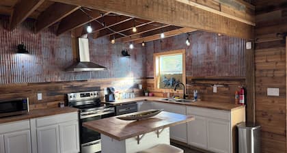 Charming and quiet 1-bedroom loft barndominium on 12 acres with RV hookups