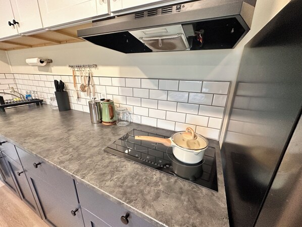 Superior Studio, Kitchenette | Private kitchen | Fridge, microwave, stovetop, cookware/dishes/utensils - Basecamp (Sagle)