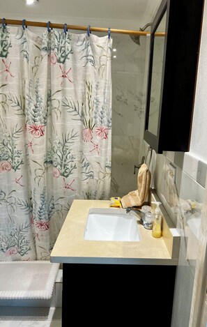Shower, towels, soap, toilet paper