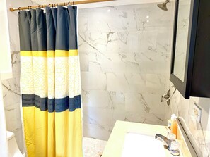 Shower, towels, soap, toilet paper