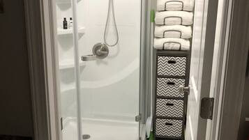 Shower, hair dryer, towels, soap