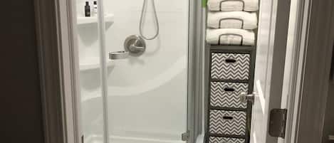 Shower, hair dryer, towels, soap