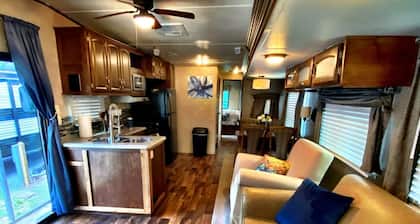 Nice 40’ RV with all modern conveniences, (full kitchen, bathroom, separate bedroom), in private Resort/campground, pool, hot tub, sauna, clubhouse available to all guests.