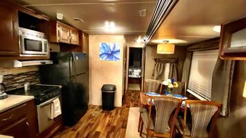 Fridge, microwave, coffee/tea maker, cookware/dishes/utensils