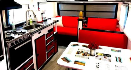 KY Derby-themed glamper nestled in a beautiful treed area of the park. Sleeps 2-3, futon + drop-down table for 2nd bed. Staying here entitles our guests to access all of the park's amenities like the sparkling pool and spa with waterfall and cave gro