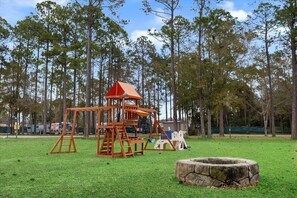 Children's area - Super- fun camper with plenty of room for a full-size family, lots of comfy beds + full kitchen, bath, and separate bedroom for Mom & Dad.  There's even a nice patio with outdoor kitchen and seating area for barbecues, bacon & eggs in the morning, et (Pace)
