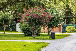 Property grounds - Spacious luxury RV with large kitchen/living room area, private bedroom w/king-size bed, bath and 1/2, with a deck, located in a beautiful RV resort with tons of amenities. Min. stay is 2 nights w/weekly and monthly discounts.  Monthly rate is $1,600 (Pace)