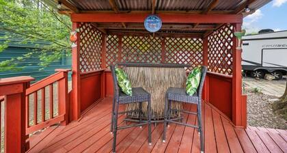 THIS IS AN AWESOME 36' RENTAL CAMPER WITH AMAZING LONG DECK, PLUS A SECOND STEP-DOWN DECK TO YOUR OWN PRIVATE HIDEAWAY TIKI BAR! A BEAUTIFUL HUGE LIVE OAK COVERS THE ENTIRE LOT SO IT'S ALWAYS SHADED, AND THIS EVEN COMES WITH A TABLE & CHAIRS FOR OUT