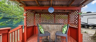 THIS IS AN AWESOME 36' RENTAL CAMPER WITH AMAZING LONG DECK, PLUS A SECOND STEP-DOWN DECK TO YOUR OWN PRIVATE HIDEAWAY TIKI BAR! A BEAUTIFUL HUGE LIVE OAK COVERS THE ENTIRE LOT SO IT'S ALWAYS SHADED, AND THIS EVEN COMES WITH A TABLE & CHAIRS FOR OUT