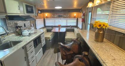 The "Bunkhouse" (western-themed glamper) sleeps 2 to 4 avg size people. There's even a bar with real western saddles for barstools! All new electric appliances, so super-easy to "glamp" in a beautiful, treed area of the park. Access to the park's am