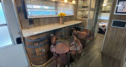 The "Bunkhouse" (western-themed glamper) sleeps 2 to 4 avg size people. There's even a bar with real western saddles for barstools! All new electric appliances, so super-easy to "glamp" in a beautiful, treed area of the park. Access to the park's am