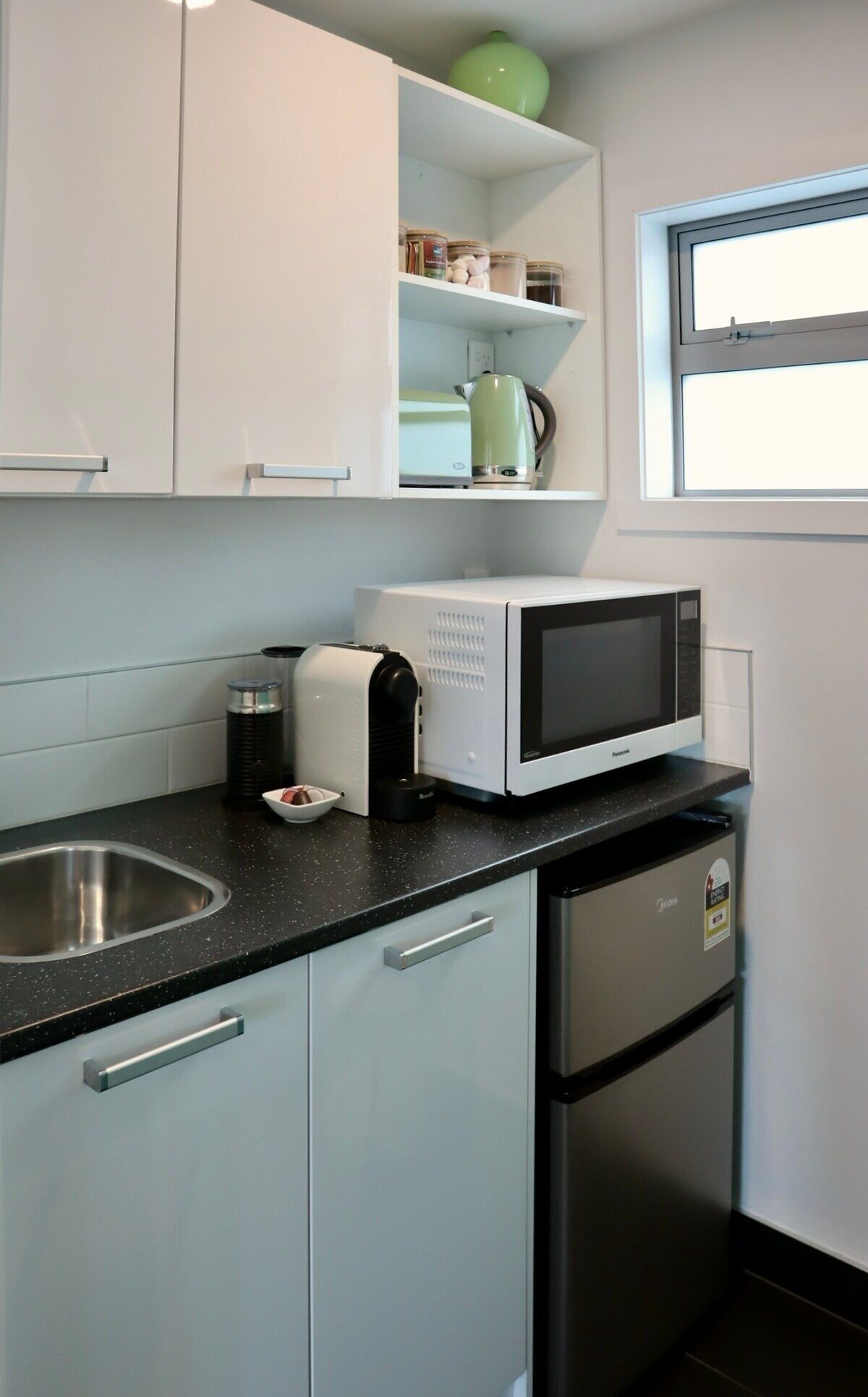 Microwave, coffee/tea maker, toaster, cookware/dishes/utensils