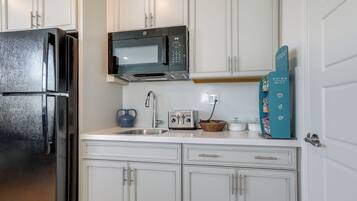 Fridge, microwave, stovetop, coffee/tea maker