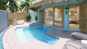 Una piscina con techo de paja, un área de spa y una silla de playa.