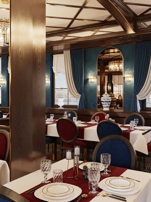 A restaurant interior with tables set for dining, featuring a classic design with chandeliers and curtains. - Botel Albatros (Prague)