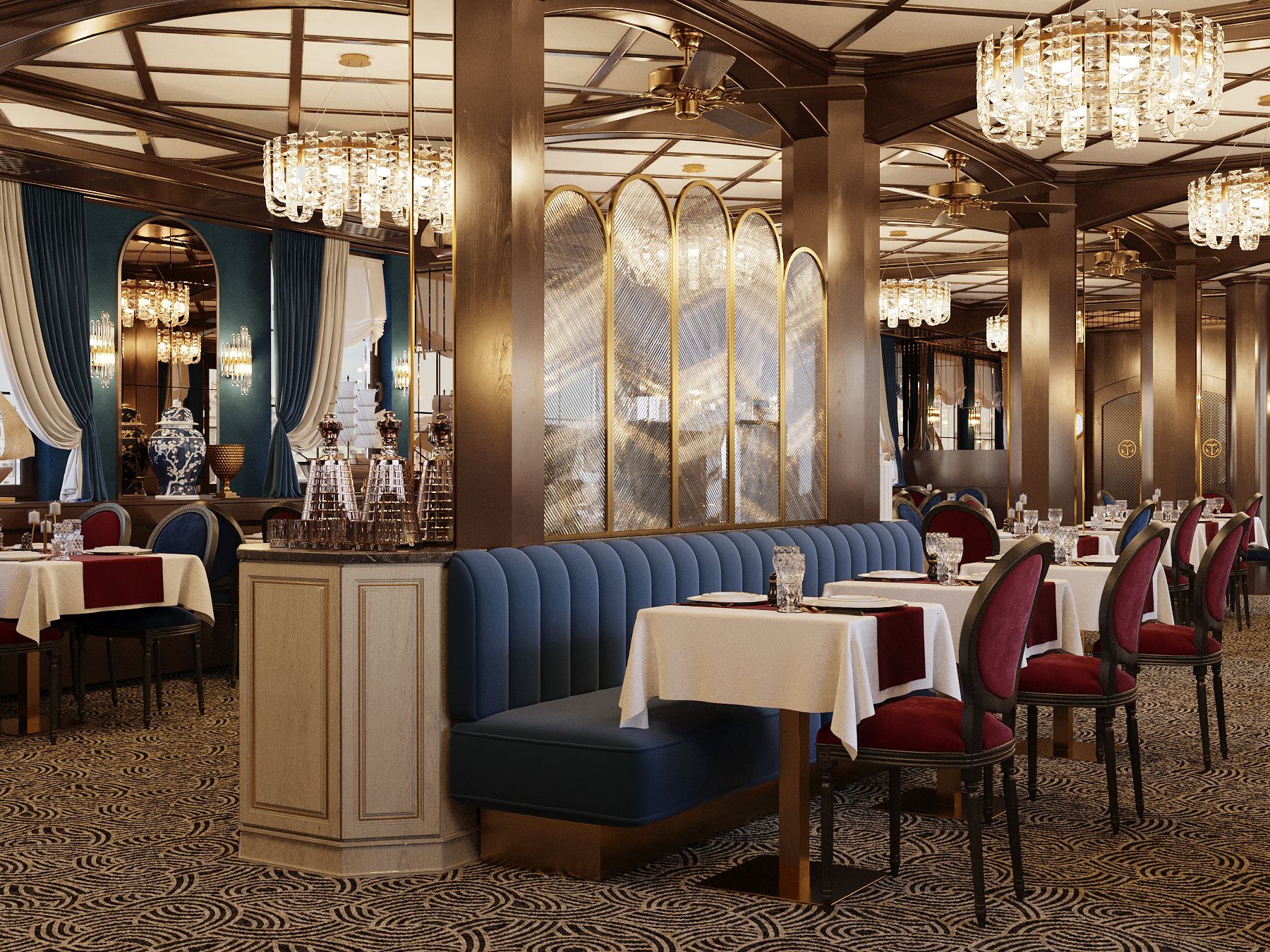 A restaurant with a blue booth seating area, multiple tables with red upholstered chairs, and chandeliers.