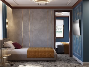 Ein Hotelzimmer mit einem Bett, einem Nachttisch, einem Fernseher und einem gemusterten Teppich.