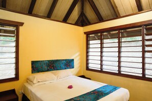A room with a bed, a wooden ceiling, and windows with bars. - Funky Fish Beach Resort (Malolo Island)