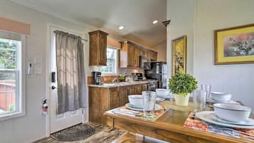 Fridge, microwave, electric kettle, dining table