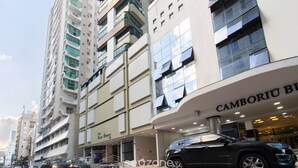 A modern building with a storefront labeled "Camboriu Boutique Hotel".